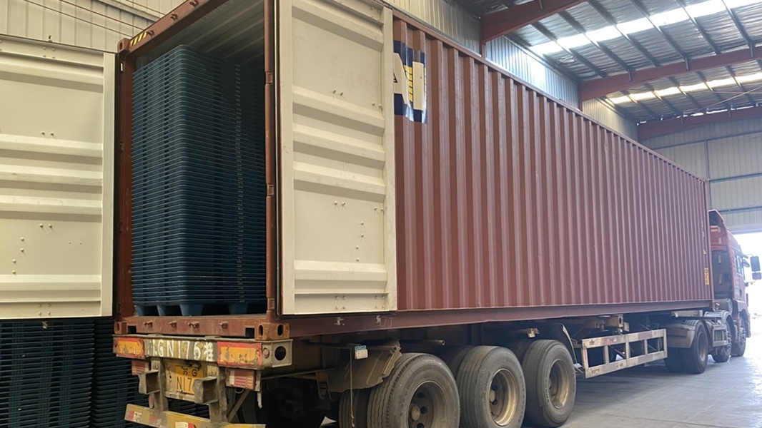 Pallets and crates staged for container loading